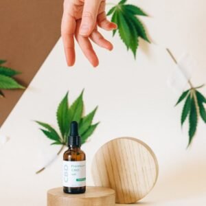 A Hand Over a CBD Product